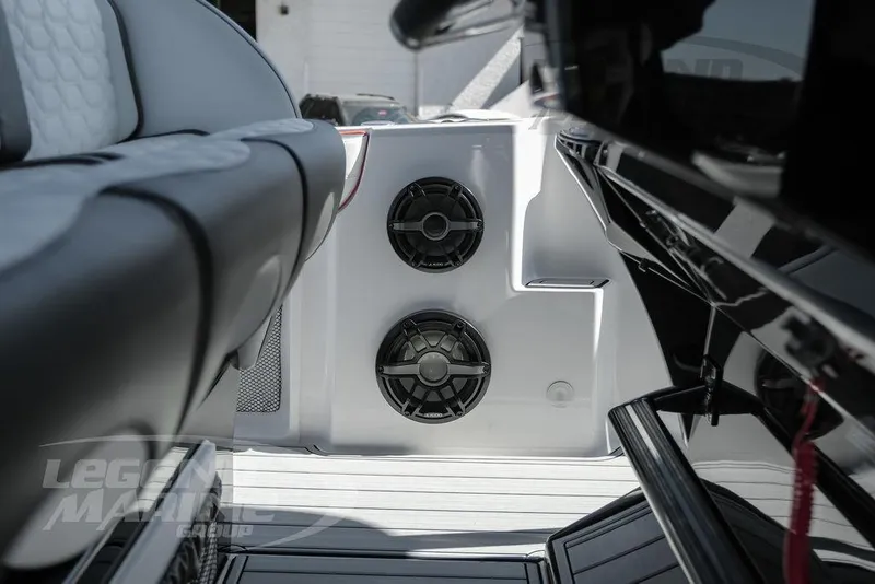Slide: The Image of 2024 Nor-Tech 340 Sport boat interior with speakers and seating. - 40