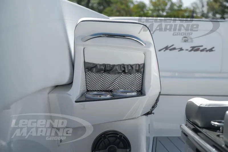Slide: The Image of 2024 Nor-Tech 340 Sport boat interior with cup holders and speaker. - 41