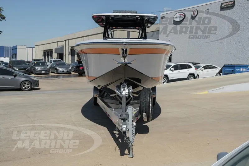 Slide: The Image of 2024 Nor-Tech 340 Sport boat on trailer at Legend Marine Group dealership. - 8