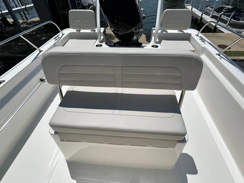 Slide: The Image of 2025 Boston Whaler 190 Montauk boat interior with cushioned seating. - 10