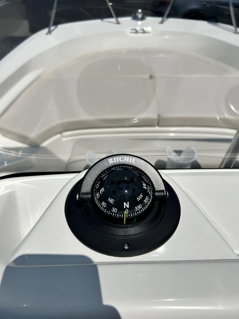 Slide: The Image of Compass on the dashboard of a 2025 Boston Whaler 190 Montauk boat. - 6