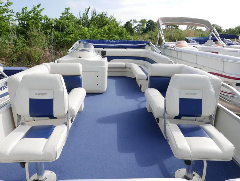 Slide: The Image of 2005 Odyssey Pontoons Millenium 2 boat interior with blue and white seating. - 3