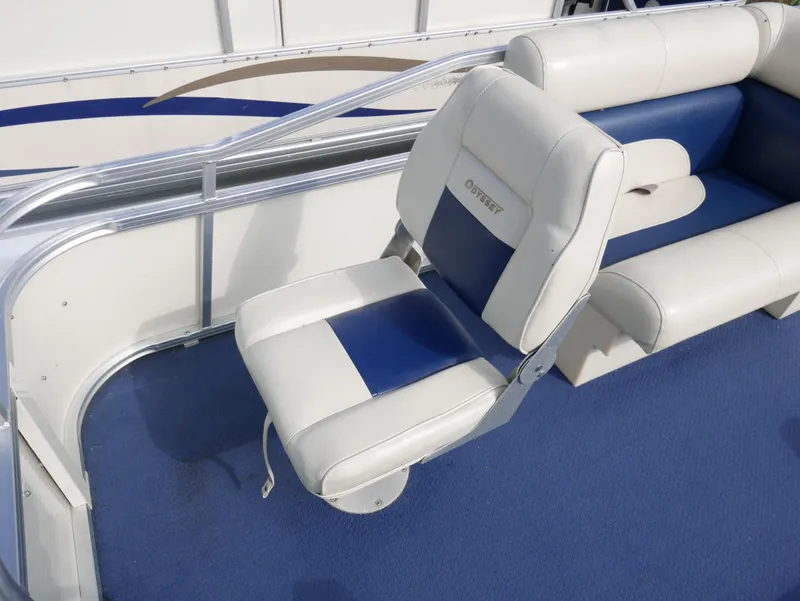 Slide: The Image of 2005 Odyssey Pontoons Millenium 2 boat with blue and white seating. - 5