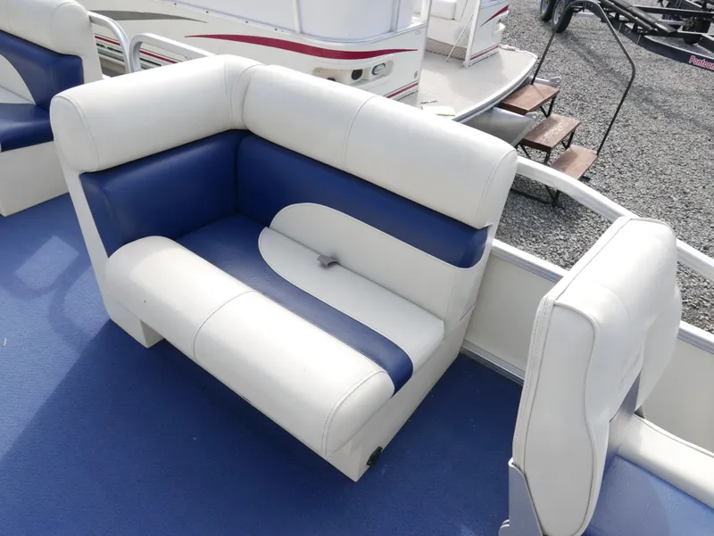 Slide: The Image of 2005 Odyssey Pontoons Millenium 2 boat seating with blue and white upholstery. - 6