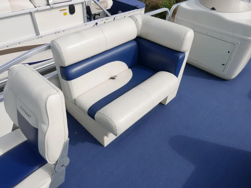 Slide: The Image of 2005 Odyssey Pontoons Millenium 2 boat seating with blue and white upholstery. - 7