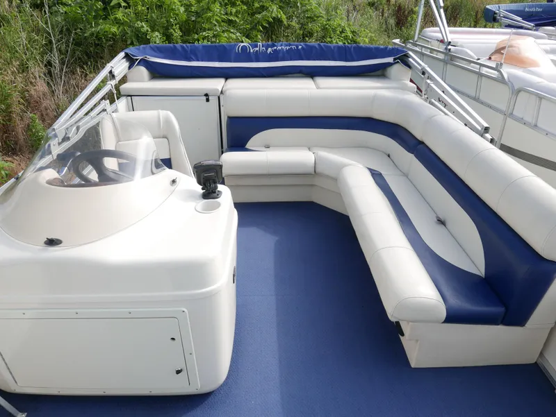 Slide: The Image of 2005 Odyssey Pontoons Millenium 2 boat interior with white and blue seating. - 8