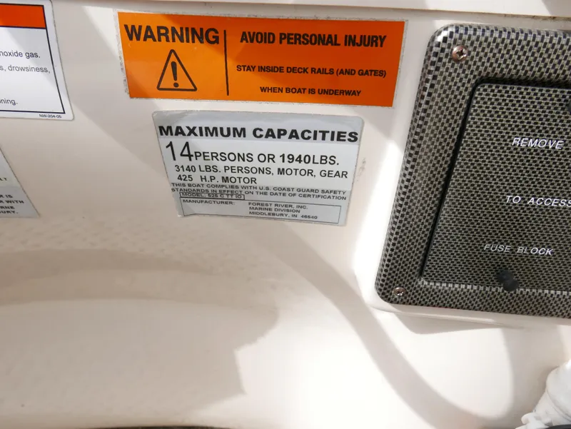 Slide: The Image of 2006 Odyssey Pontoons 525CTTI/O capacity warning labels and safety instructions - 12