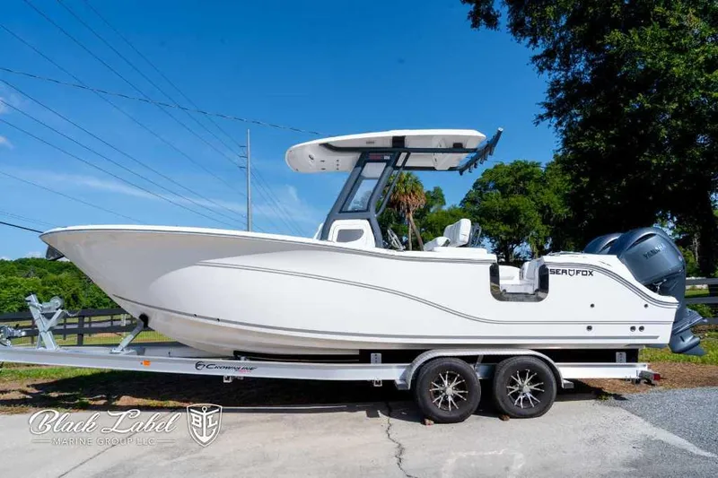 Slide: The Image of 2025 Sea Fox 268 Commander Center Console boat on trailer. - 0