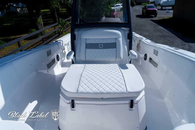 Slide: The Image of 2025 Sea Fox 268 Commander Center Console boat interior with white seating. - 10