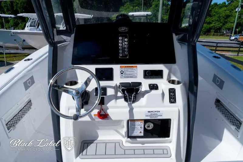 Slide: The Image of 2025 Sea Fox 268 Commander Center Console boat dashboard and steering wheel. - 14