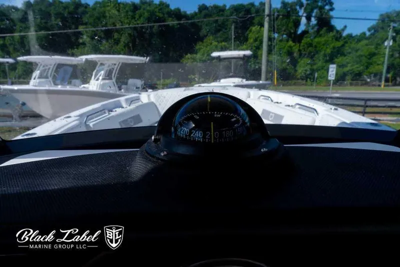 Slide: The Image of Compass view from the helm of a 2025 Sea Fox 268 Commander Center Console boat. - 21