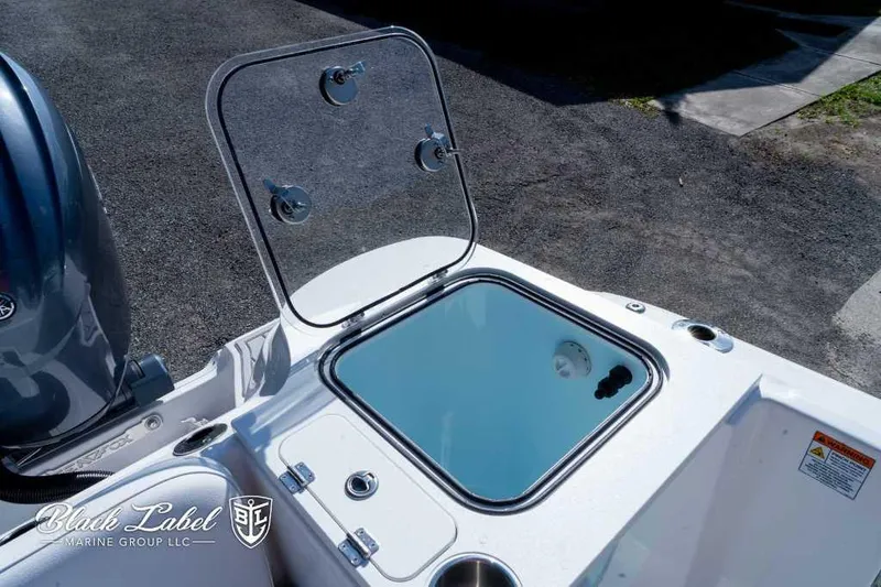 Slide: The Image of Sea Fox 268 Commander Center Console 2025 livewell with open lid. - 24