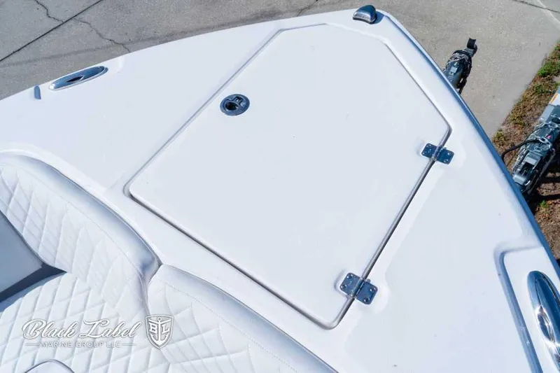 Slide: The Image of 2025 Sea Fox 268 Commander Center Console boat deck with storage compartment. - 8