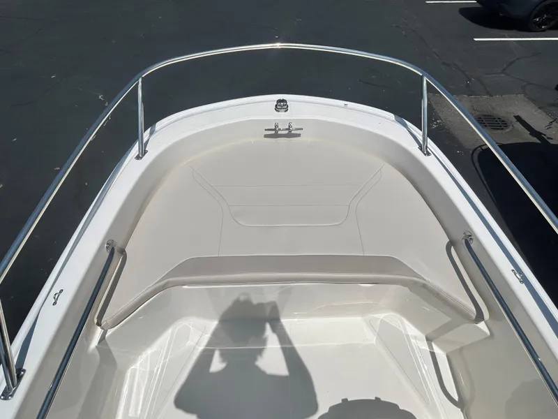 Slide: The Image of 2025 Boston Whaler 130 Super Sport boat bow with stainless steel railings. - 9