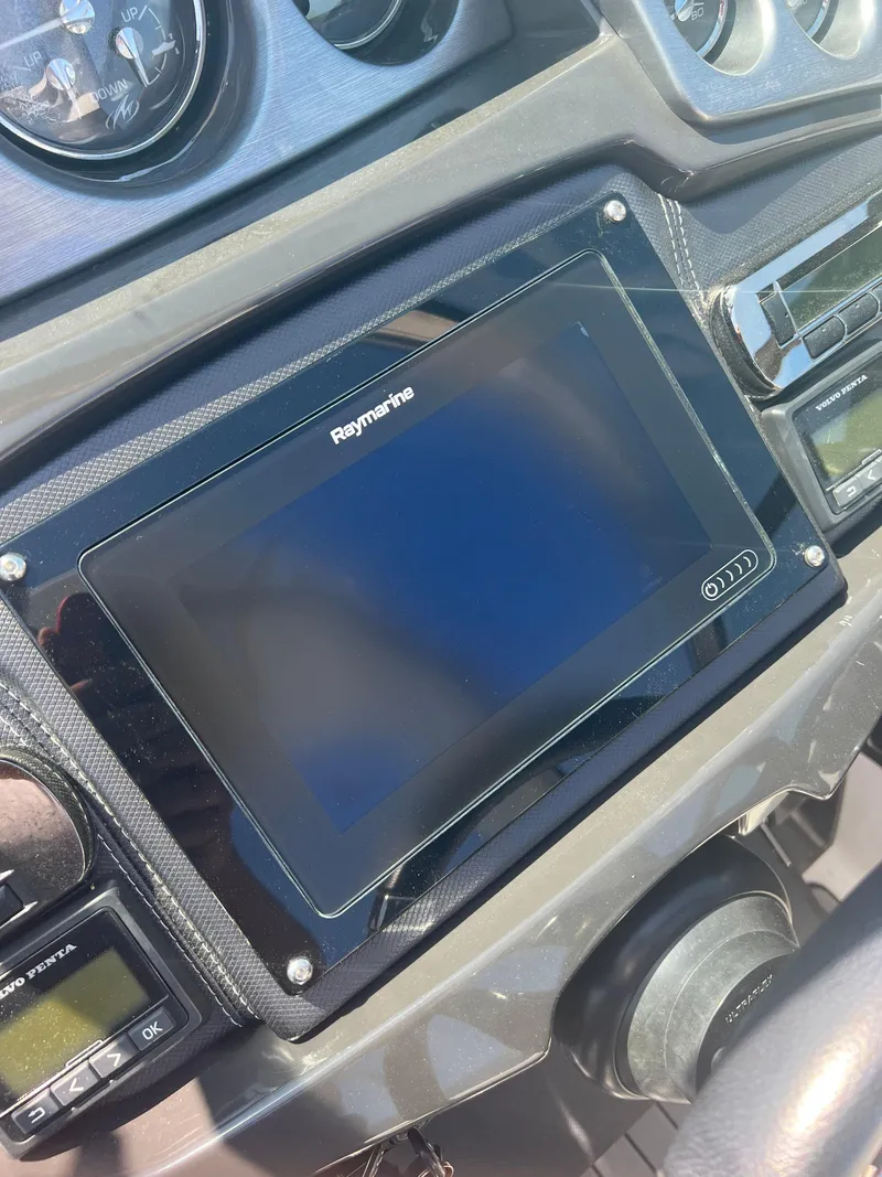 Slide: The Image of Dashboard of a 2018 Monterey 328 Super Sport boat with Raymarine display. - 6