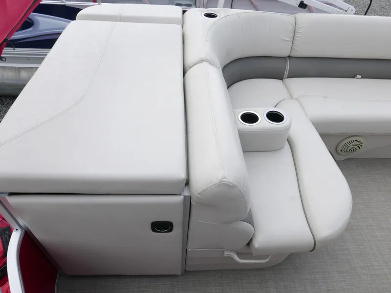 Slide: The Image of 2016 Bennington 208SL boat with white leather seating and cup holders. - 11