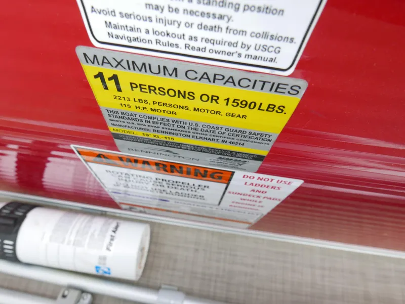 Slide: The Image of 2016 Bennington 208SL maximum capacity label, 11 persons or 1590 lbs, safety warnings. - 13