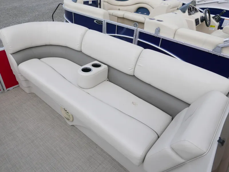 Slide: The Image of 2016 Bennington 208SL boat with white and gray cushioned seating. - 6