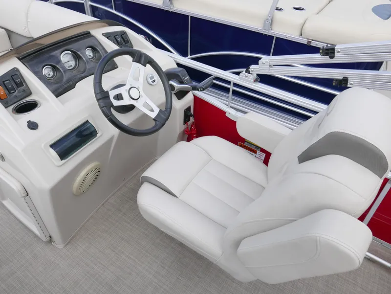Slide: The Image of 2016 Bennington 208SL boat helm with steering wheel and captain's chair. - 8