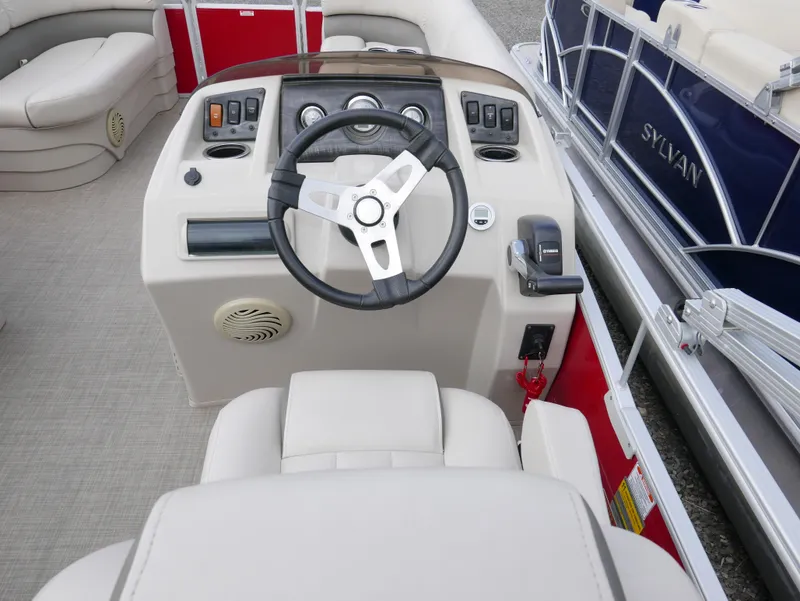Slide: The Image of 2016 Bennington 208SL boat dashboard with steering wheel and controls. - 9