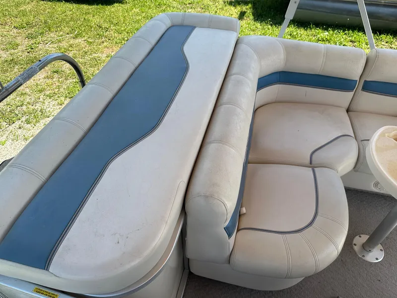 Slide: The Image of 2006 Godfrey Aqua Patio 200 RE boat seating area with blue and white upholstery. - 13