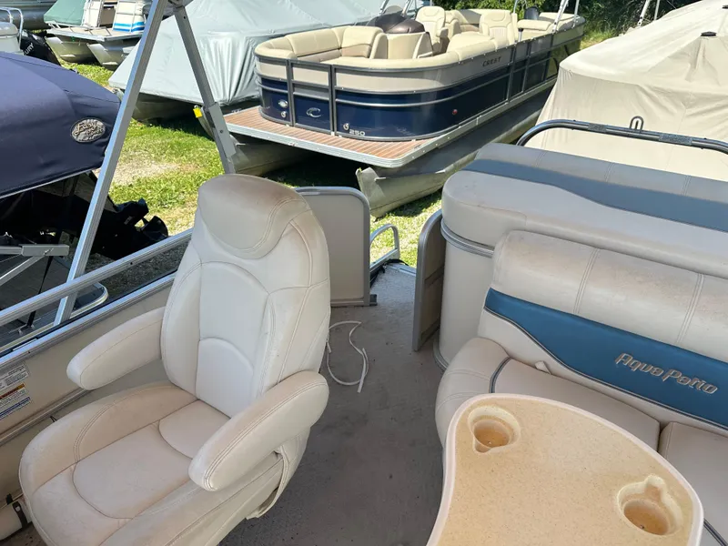 Slide: The Image of 2006 Godfrey Aqua Patio 200 RE pontoon boat interior with seating and cup holders. - 14