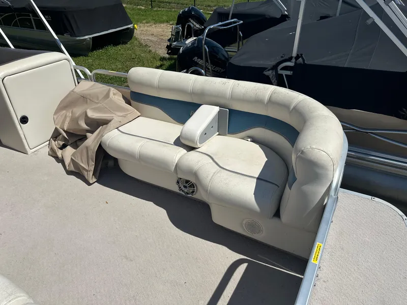Slide: The Image of 2006 Godfrey Aqua Patio 200 RE pontoon boat with white seating and storage cover. - 6