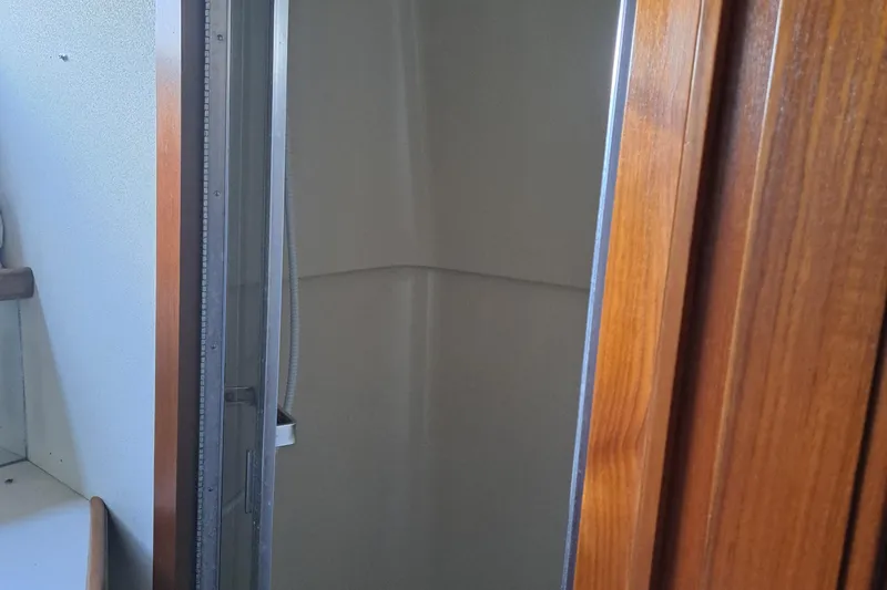 Slide: The Image of Shower area in 1989 Carver 3807 yacht with wooden door. - 20