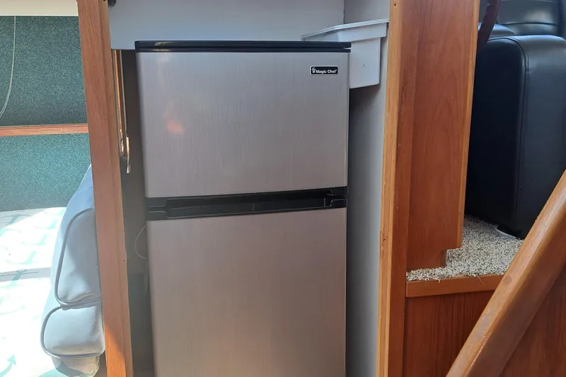 Slide: The Image of Compact refrigerator in the interior of a 1989 Carver 3807 yacht. - 26