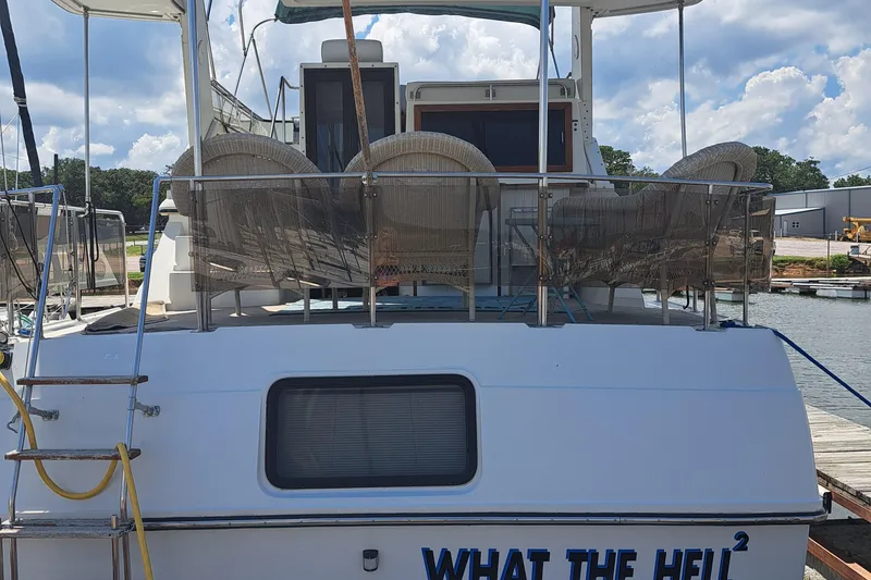 Slide: The Image of 1989 Carver 3807 yacht docked at marina with What The Hell² name. - 4