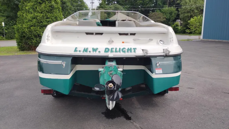 Slide: The Image of 1999 Four Winns 200 Horizon boat rear view with L.N.W. Delight name. - 6