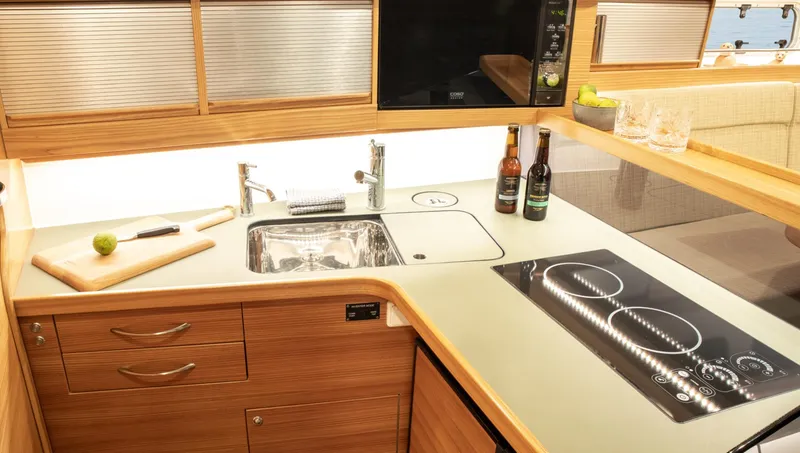 Slide: The Image of Modern kitchen in 2026 Dragonfly 40 yacht with sleek design and appliances. - 11
