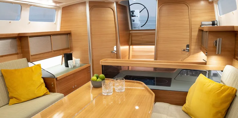 Slide: The Image of Luxurious interior of 2026 Dragonfly 40 yacht with wooden finishes and cozy seating. - 10