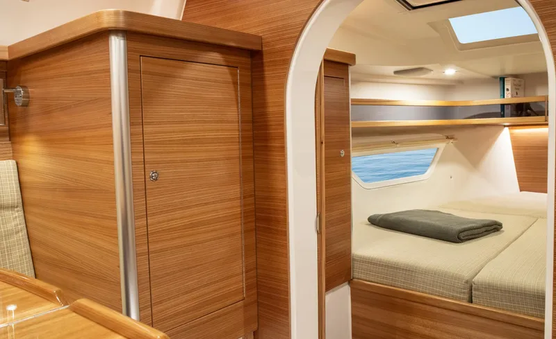 Slide: The Image of Luxurious interior of 2026 Dragonfly 40 yacht with wood finish and cozy sleeping area. - 14
