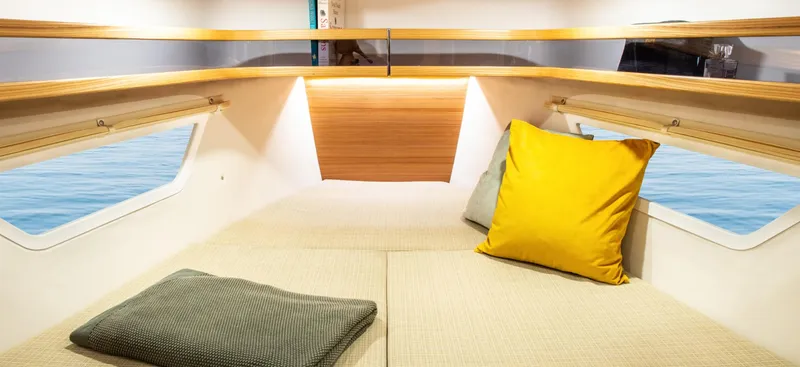 Slide: The Image of Cozy interior of 2026 Dragonfly 40 yacht with cushions and wooden accents. - 15