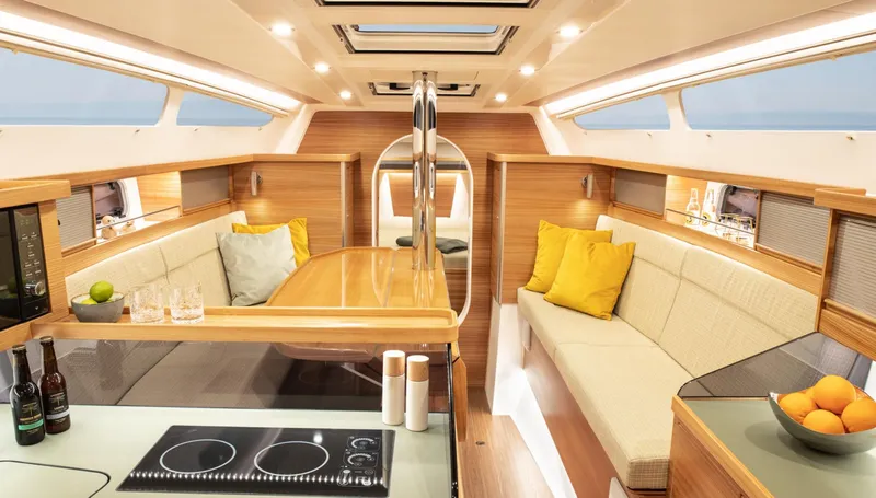 Slide: The Image of Luxurious interior of 2026 Dragonfly 40 yacht with modern kitchen and cozy seating area. - 9