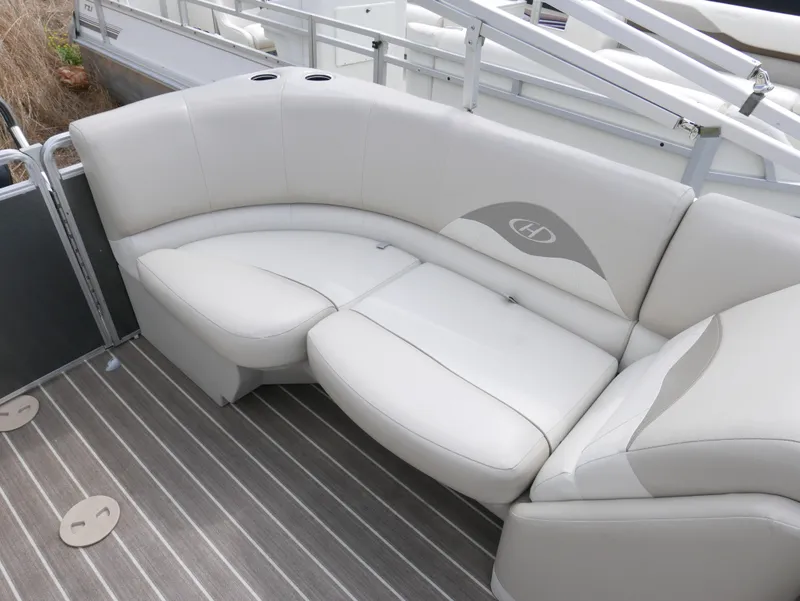 Slide: The Image of 2016 Harris 200 Cruiser pontoon boat with white cushioned seating. - 10