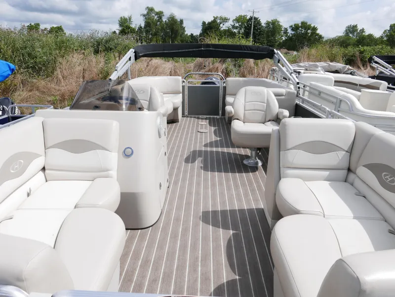 Slide: The Image of 2016 Harris 200 Cruiser pontoon boat with spacious seating and modern design. - 3