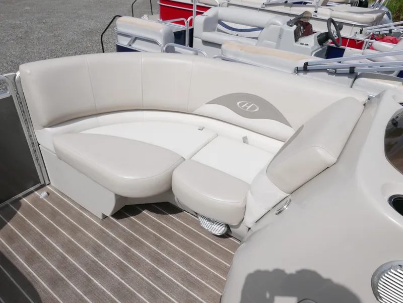 Slide: The Image of 2016 Harris 200 Cruiser boat with beige seating and striped flooring. - 4