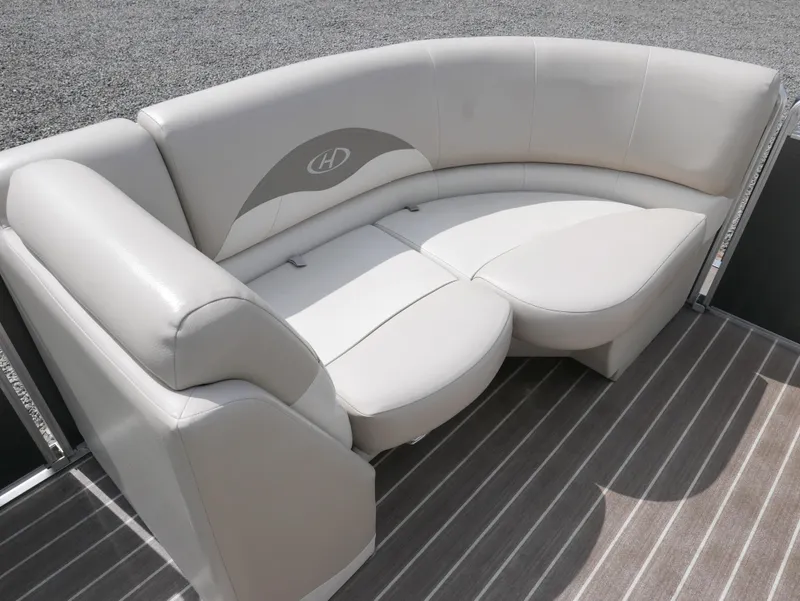 Slide: The Image of 2016 Harris 200 Cruiser boat with beige leather seating and striped flooring. - 5