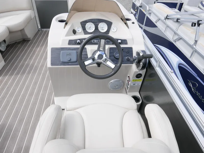 Slide: The Image of 2016 Harris 200 Cruiser boat helm with steering wheel and gauges. - 9