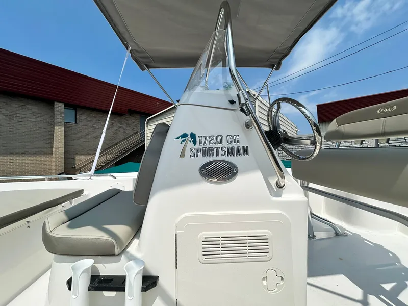 Slide: The Image of 2025 Key West 1720 Center Console boat interior with steering wheel and seating. - 4