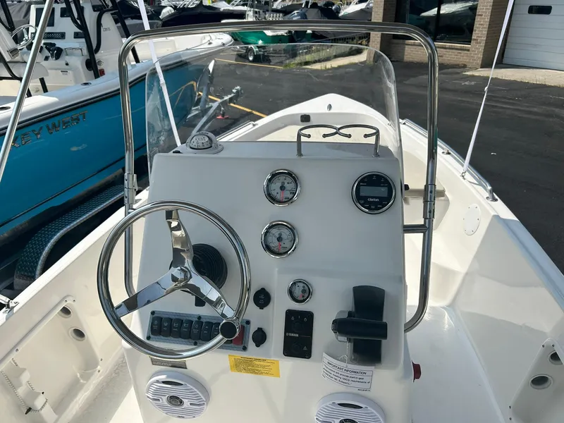 Slide: The Image of 2025 Key West 1720 Center Console boat dashboard and steering wheel. - 5