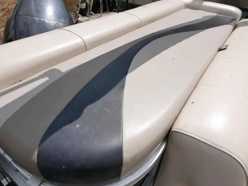 Slide: The Image of 2009 Sylvan Mirage 8520 Cruise boat seat with beige and black upholstery. - 12