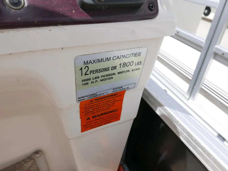 Slide: The Image of 2009 Sylvan Mirage 8520 Cruise capacity label, 12 persons or 1800 lbs. - 14