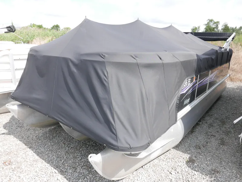 Slide: The Image of 2009 Sylvan Mirage 8520 Cruise pontoon boat with black cover. - 2