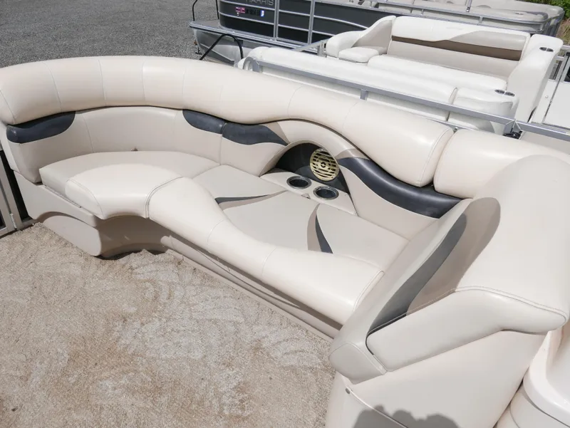 Slide: The Image of 2009 Sylvan Mirage 8520 Cruise boat with beige and black seating. - 6
