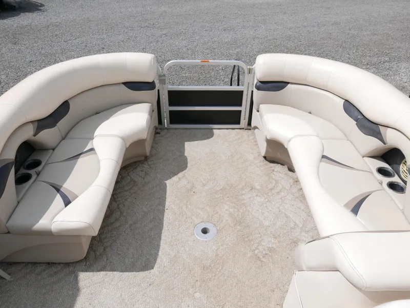Slide: The Image of 2009 Sylvan Mirage 8520 Cruise boat interior with beige seating. - 7