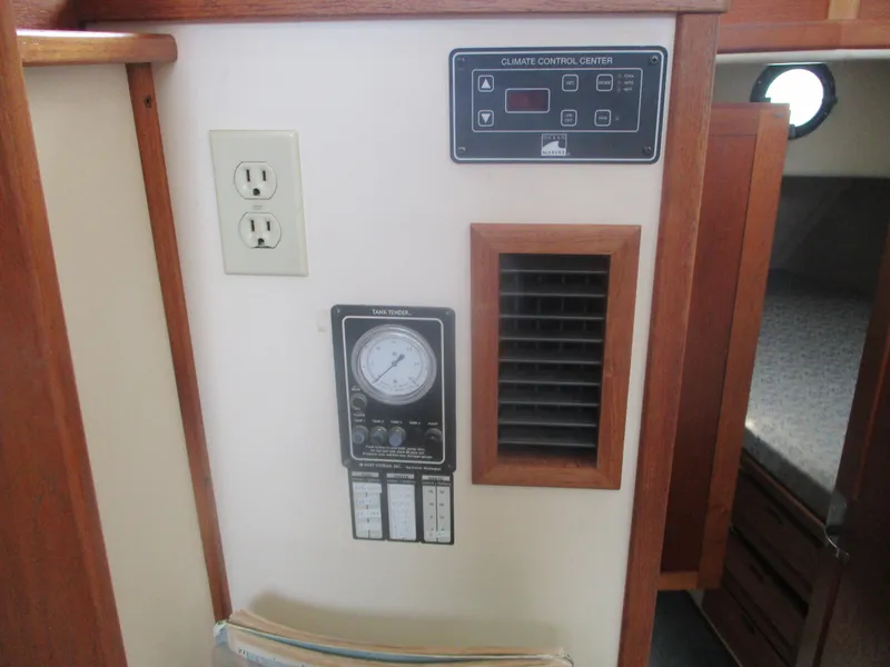 Slide: The Image of 1998 Nordic Tug 32 interior with climate control panel and electrical outlet. - 18