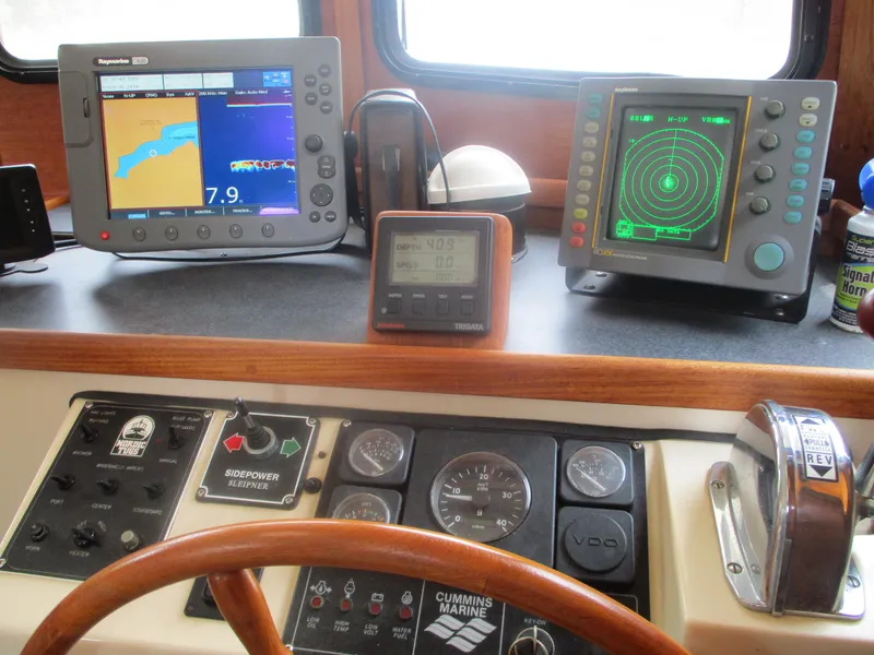 Slide: The Image of Control panel of a 1998 Nordic Tug 32 with navigation and radar displays. - 20